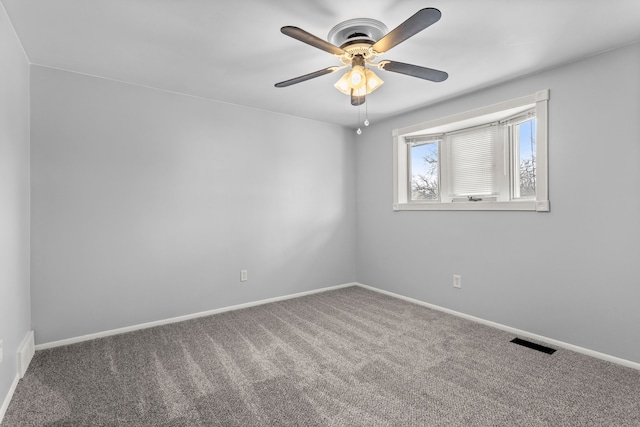 spare room featuring carpet flooring and ceiling fan