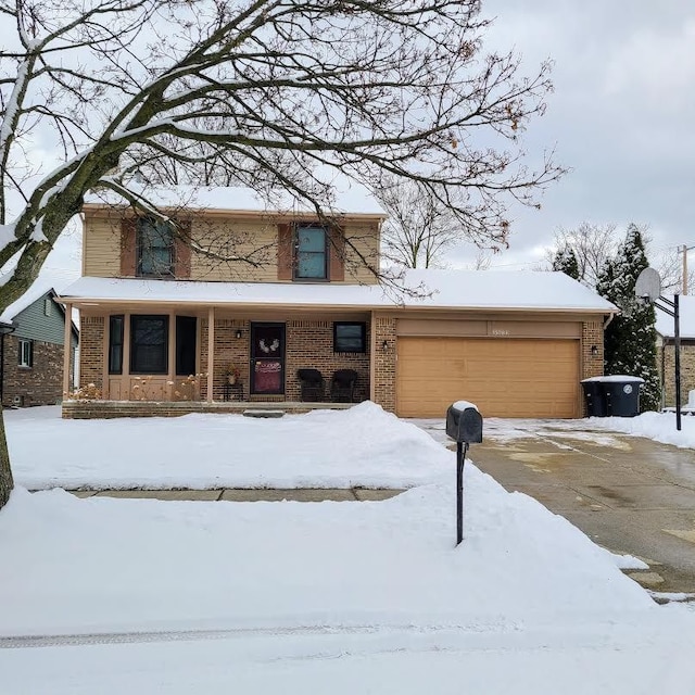 view of front property featuring a porch and a garage