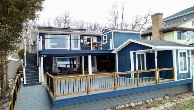 back of house featuring a balcony