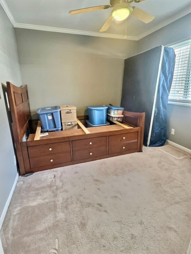 unfurnished bedroom featuring light carpet, ceiling fan, and ornamental molding