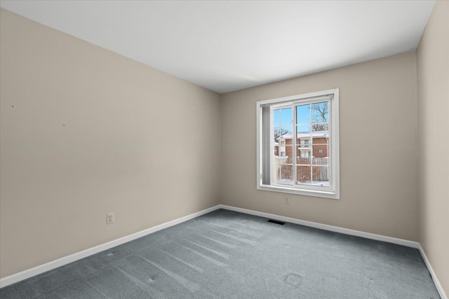 unfurnished room featuring carpet floors