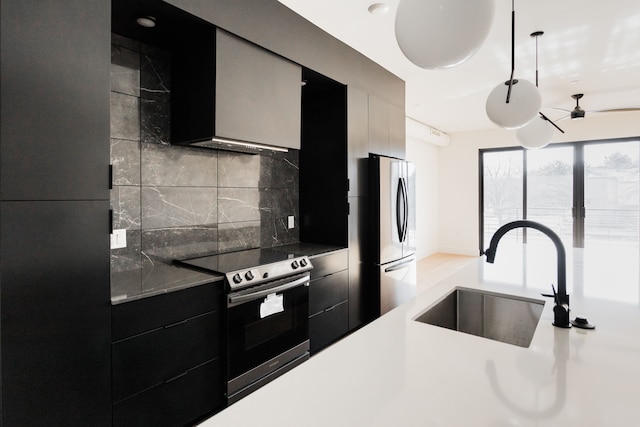 kitchen featuring stainless steel appliances, tasteful backsplash, and sink