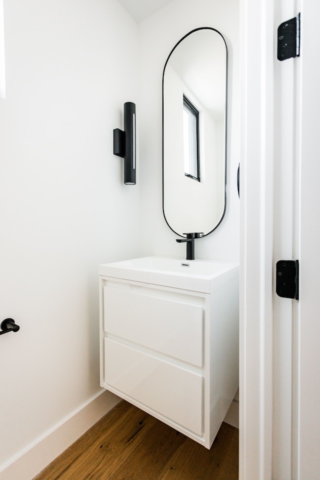 bathroom with wood-type flooring and vanity