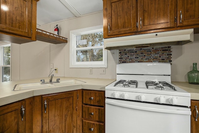 kitchen with sink and white gas stove