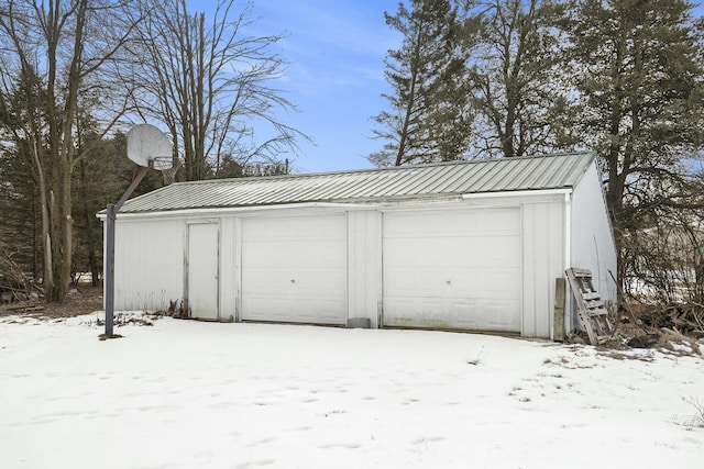 view of snow covered garage