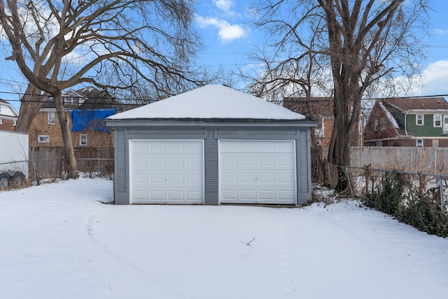 view of snow covered garage