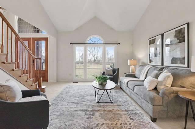 living room with stairway, carpet flooring, and vaulted ceiling