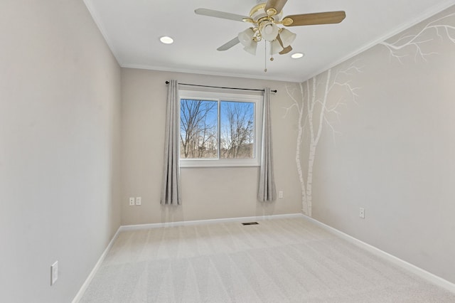 empty room featuring a ceiling fan, baseboards, recessed lighting, ornamental molding, and carpet flooring