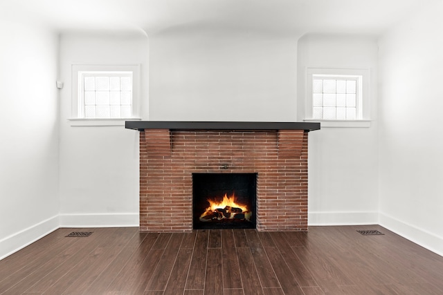 details with wood-type flooring and a fireplace