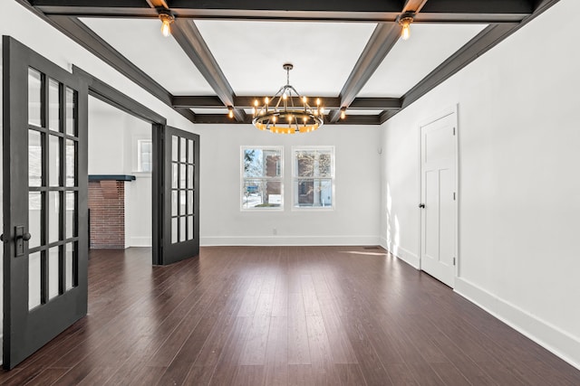 unfurnished room with dark hardwood / wood-style flooring, beam ceiling, french doors, and an inviting chandelier