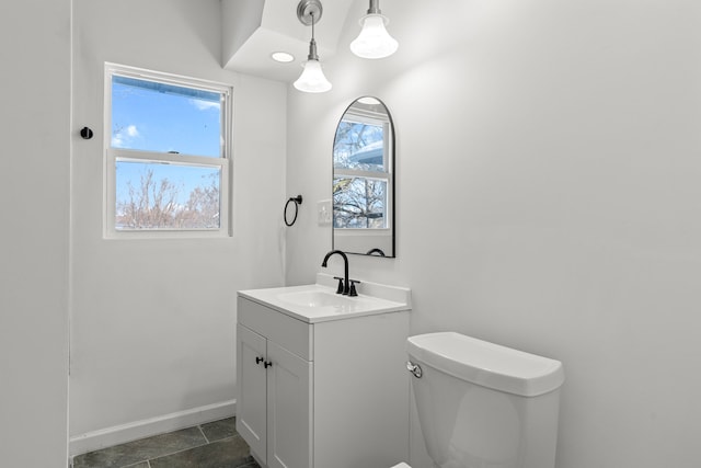 bathroom featuring vanity and toilet