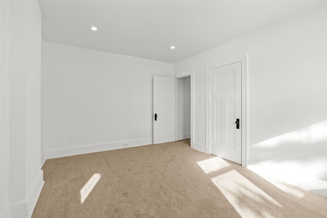 unfurnished bedroom featuring light colored carpet