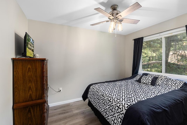 bedroom featuring hardwood / wood-style floors and ceiling fan