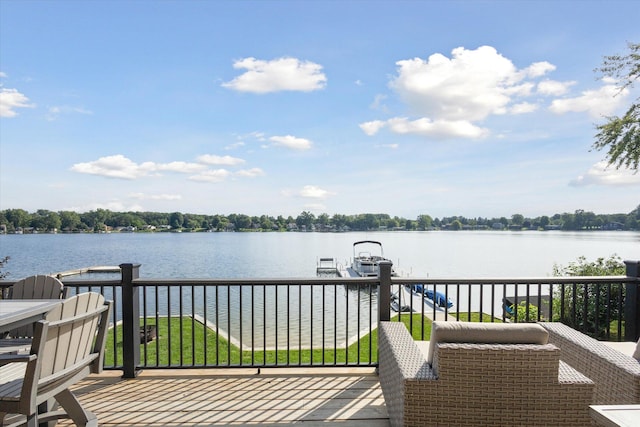 wooden deck featuring a water view