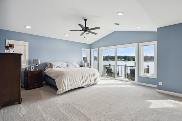 bedroom with vaulted ceiling, access to outside, light colored carpet, ceiling fan, and a water view