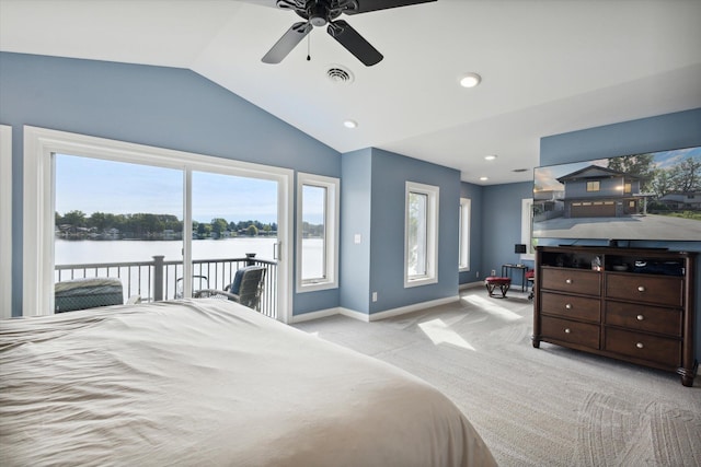 carpeted bedroom featuring lofted ceiling, access to outside, ceiling fan, and a water view