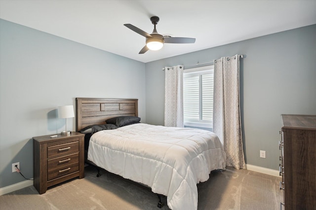 bedroom featuring light colored carpet and ceiling fan