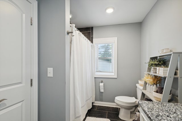 bathroom featuring tile patterned flooring, vanity, a shower with curtain, and toilet