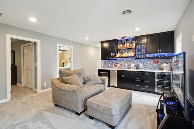 bar with light carpet, backsplash, fridge, and beverage cooler