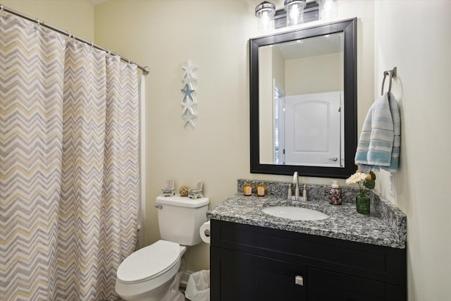 bathroom with a shower with curtain, vanity, and toilet