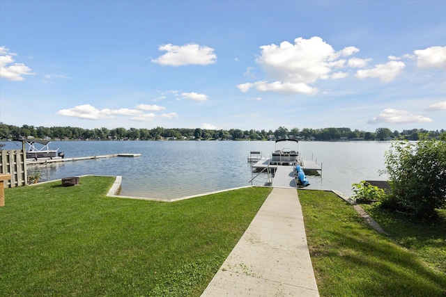 dock area with a water view and a yard