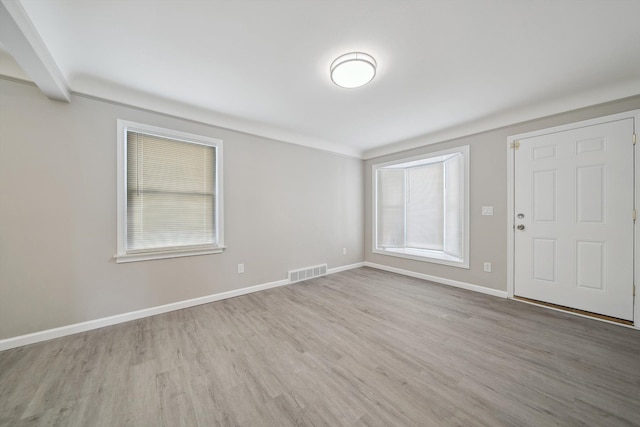 spare room with light wood-type flooring