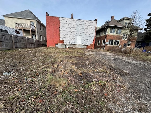 back of property featuring fence