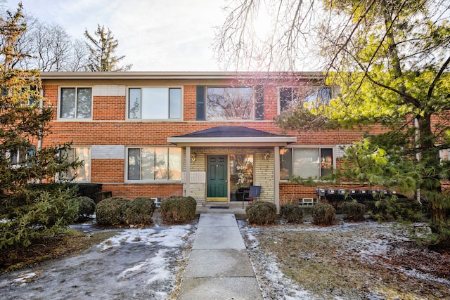 view of property featuring brick siding