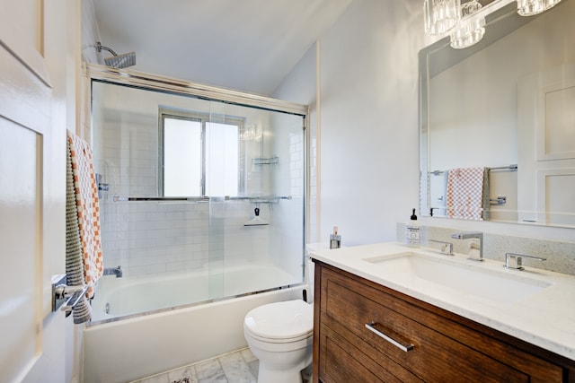 bathroom with toilet, bath / shower combo with glass door, and vanity