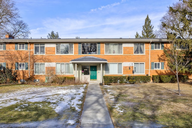 townhome / multi-family property featuring brick siding