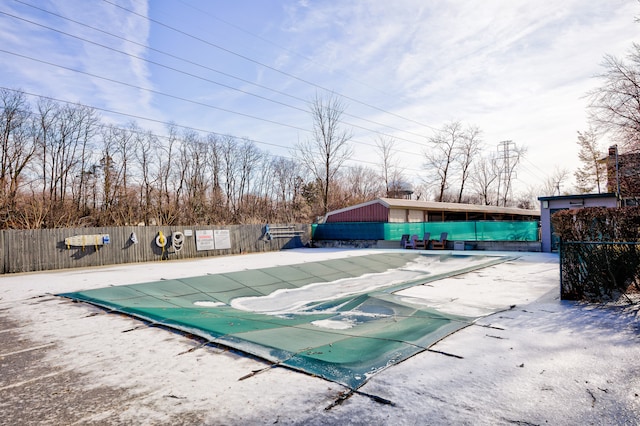 community pool featuring fence