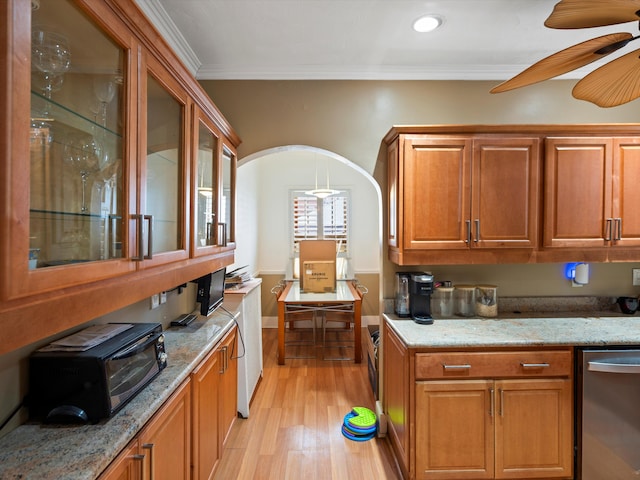 kitchen with stainless steel dishwasher, ceiling fan, crown molding, light stone countertops, and light wood-type flooring