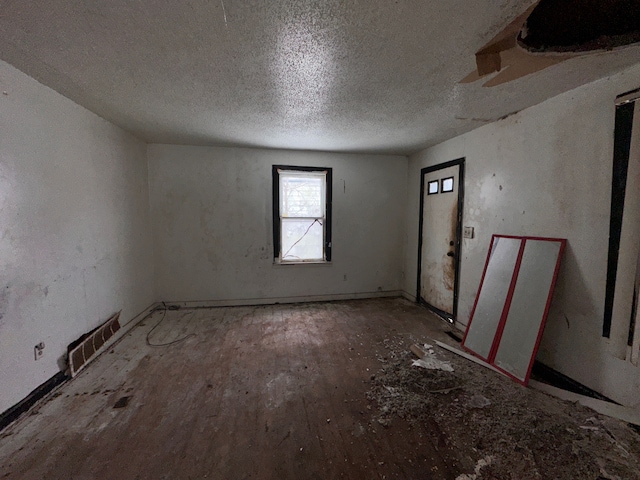 empty room featuring a textured ceiling