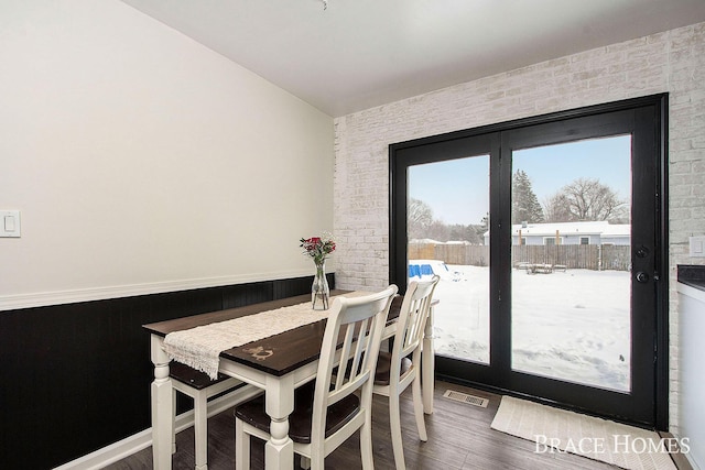 dining space featuring hardwood / wood-style floors