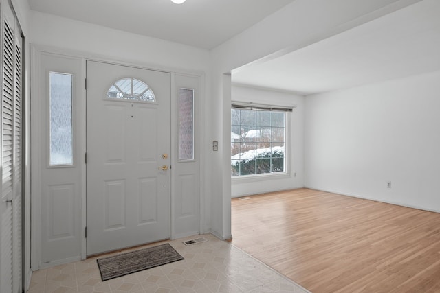 entrance foyer with light hardwood / wood-style flooring