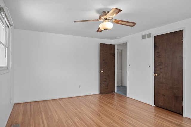 unfurnished room with ceiling fan and light hardwood / wood-style floors