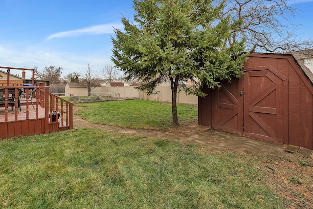 view of yard featuring a shed and a deck