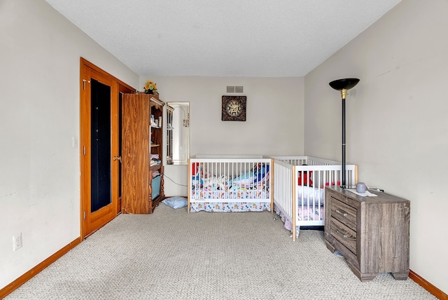 carpeted bedroom with a textured ceiling