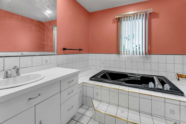 bathroom featuring vanity, a bath, and decorative backsplash