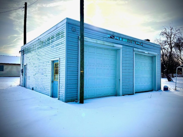 view of snow covered garage