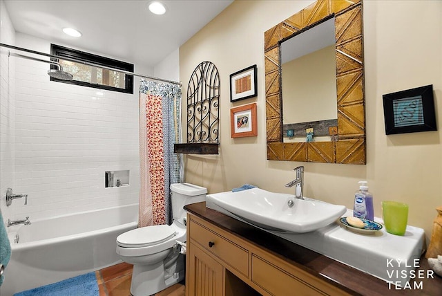 full bathroom featuring vanity, shower / bath combo, and toilet