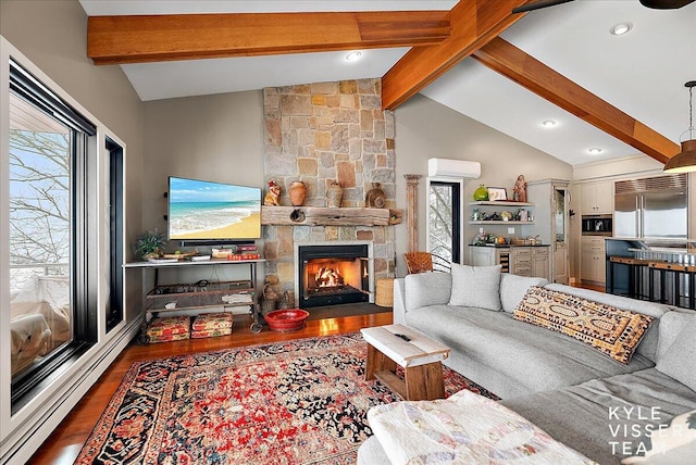 living room featuring a stone fireplace, hardwood / wood-style floors, lofted ceiling with beams, a wall mounted AC, and a baseboard heating unit