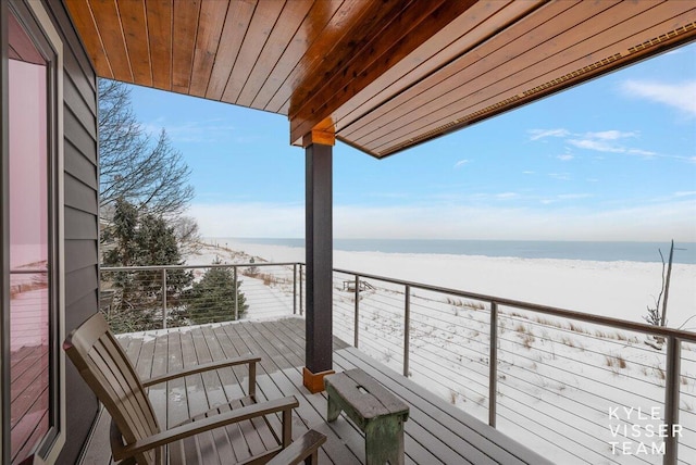 balcony with a beach view and a water view