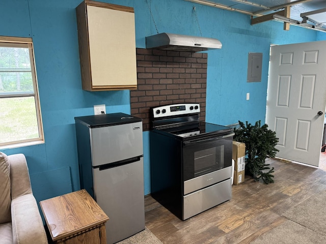 8210 N Johnson Rd, Irons, MI 49644 - kitchen with appliances with stainless steel finishes, under cabinet range hood, wood finished floors, and electric panel