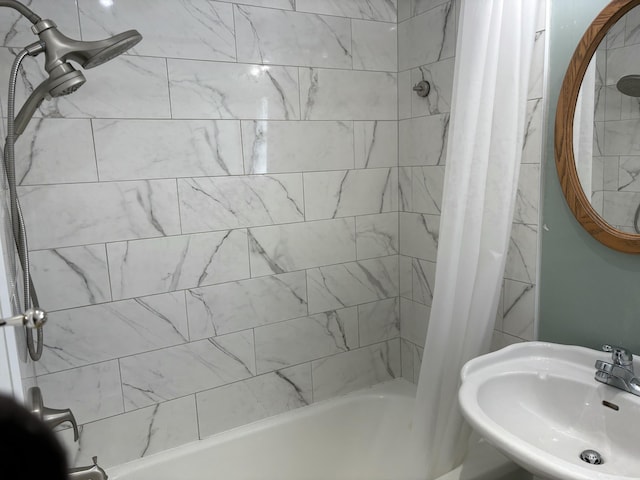 bathroom featuring sink and shower / bath combo with shower curtain