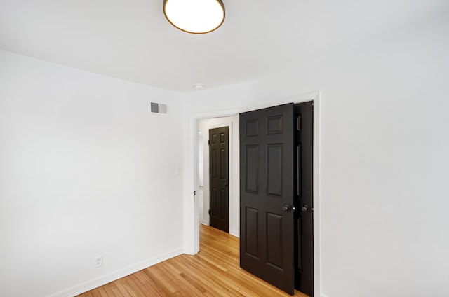 unfurnished bedroom featuring light hardwood / wood-style floors