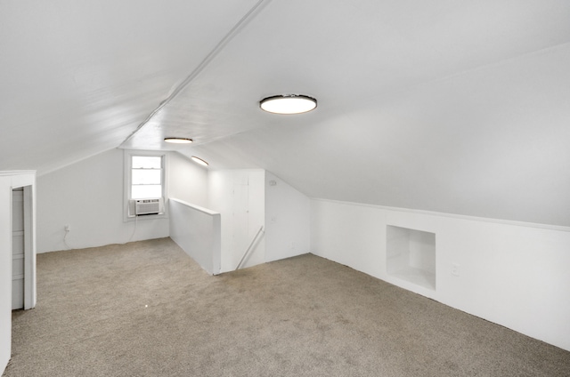 bonus room featuring light carpet, vaulted ceiling, and cooling unit