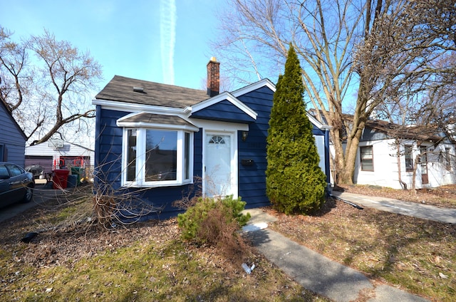 view of front of property with a chimney