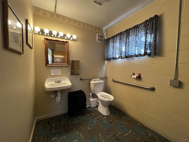 bathroom featuring sink and toilet