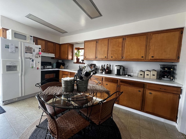 kitchen with white appliances and sink